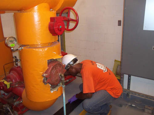 a man working on a pipe