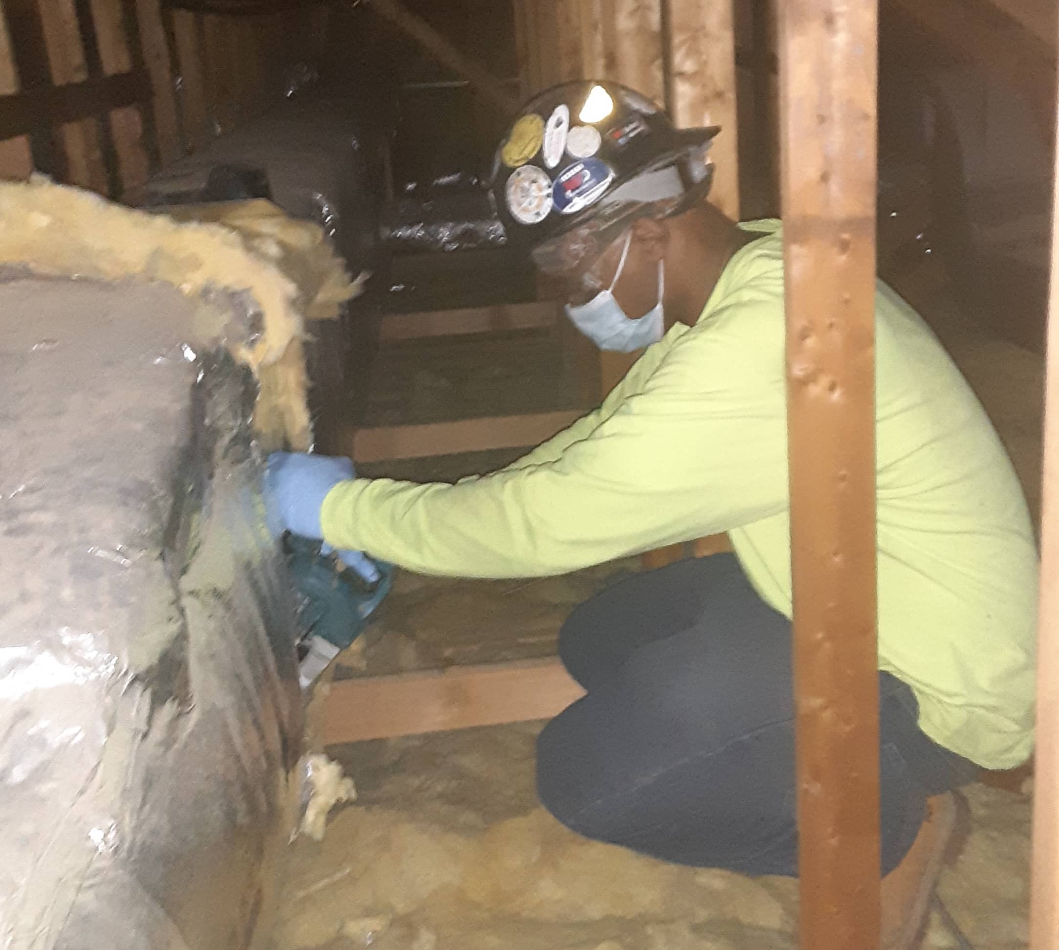 a man working in an attic