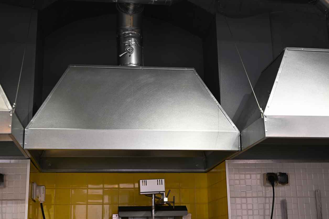 cooker hood over a stove in a restaurant